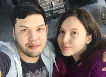 Siblings Saltanat Nukenova (at right) and Aitbek Amangeldi take a photo together in 2017.  Photo: Courtesy of Aitbek Amangeldi